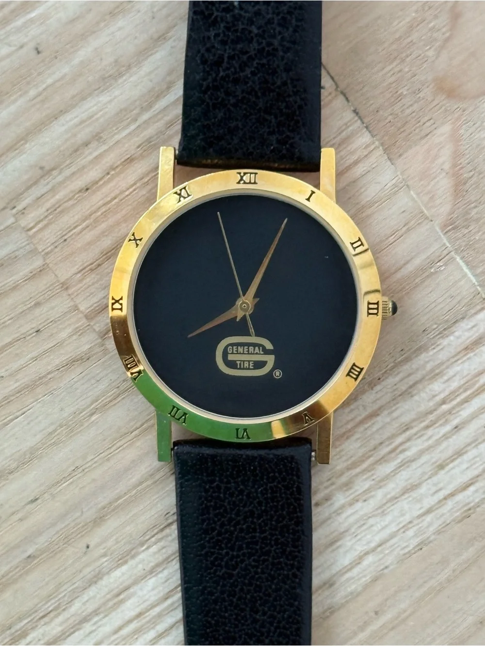 General Tire Dress Watch Black Dial Leather Strap Gold-Tone Case Hands